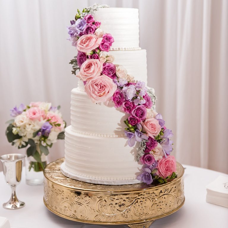 Beautiful, customized wedding cake with floral accents